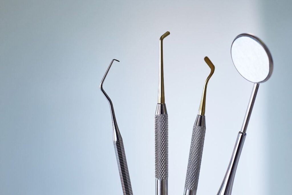 Close-up of dental tools used for cleanings and checkups to prevent cavities and gum disease.