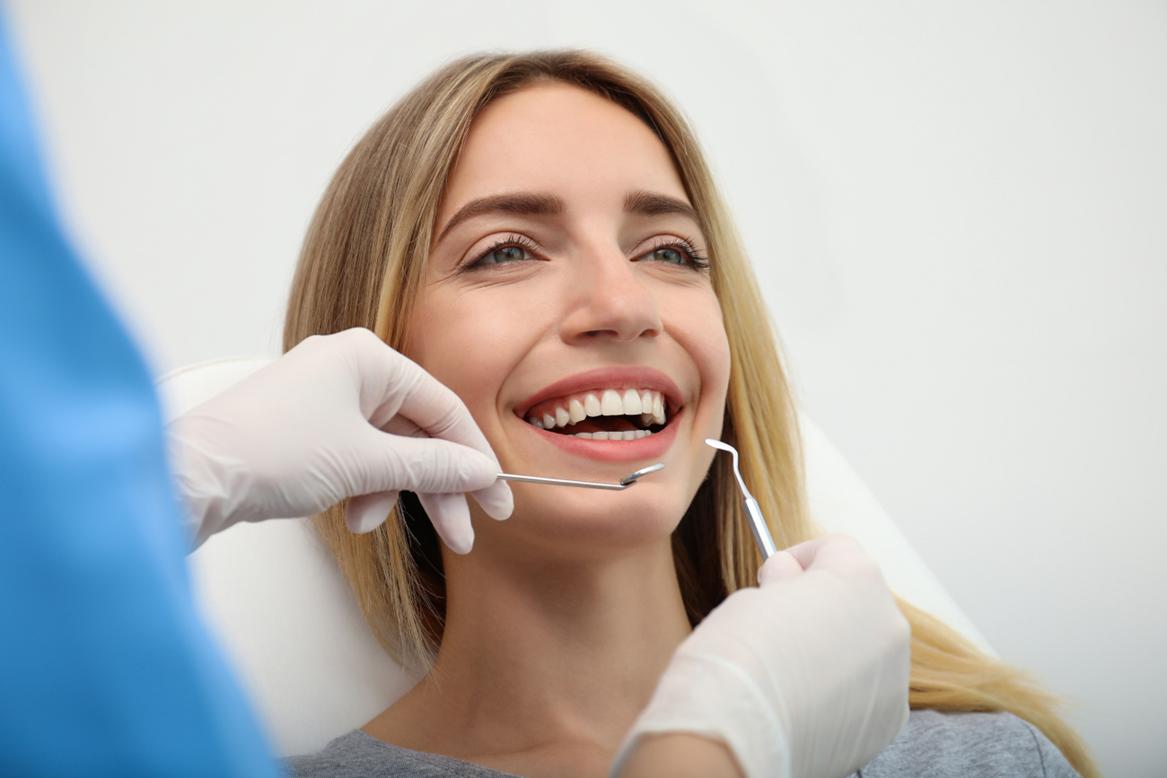 Dentist Showing Tablet Pc to Kid at Dental Clinic